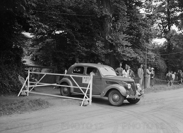 Ford V8 of J Whalley, winner of a bronze award at the MCC Torquay Rally, July 1937. Artist: Bill Brunell.