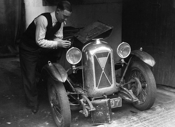 Geoffrey Baker working on a Salmson 1090cc car. Artist: Bill Brunell.