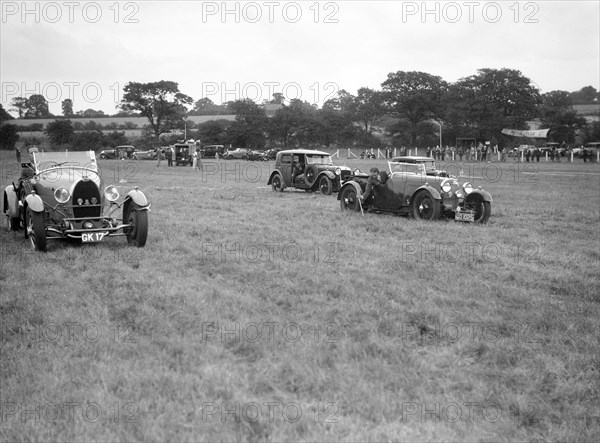 Bugatti Type 43, Aston Martin and Alvis FWD at the Bugatti Owners Club gymkhana, 5 July 1931. Artist: Bill Brunell.