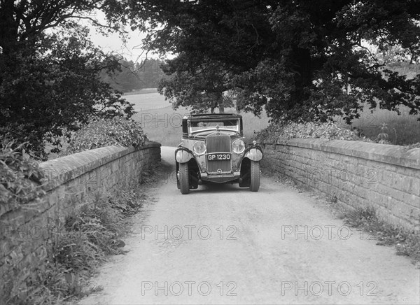 Kitty Brunell road testing a 1931 Delage D8. Artist: Bill Brunell.