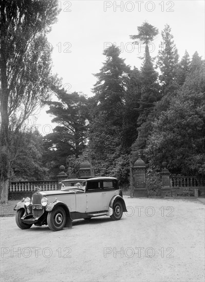 Kitty Brunell road testing a 1931 Delage D8, Wykehurst Place, Bolney, Sussex. Artist: Bill Brunell.