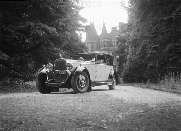 Kitty Brunell road testing a 1931 Delage D8, Wykehurst Place, Bolney, Sussex. Artist: Bill Brunell.