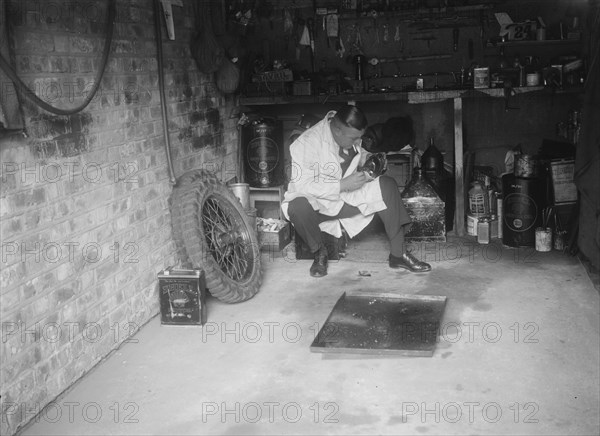 FA Thatcher in his garage. Artist: Bill Brunell.
