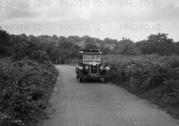 Austin 20 taking part in a First Aid Nursing Yeomanry trial or rally, 1931. Artist: Bill Brunell.