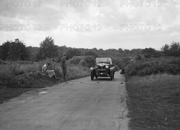Car taking part in a First Aid Nursing Yeomanry trial or rally, 1931. Artist: Bill Brunell.