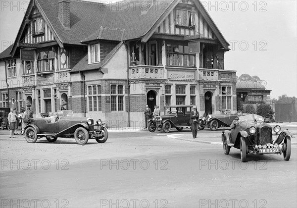 Cars at the North West London Motor Club Trial, Osterley Park Hotel, Isleworth, 1 June 1929. Artist: Bill Brunell.