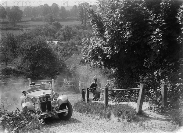 1933 Standard Avon taking part in a West Hants Light Car Club Trial, Ibberton Hill, Dorset, 1930s. Artist: Bill Brunell.