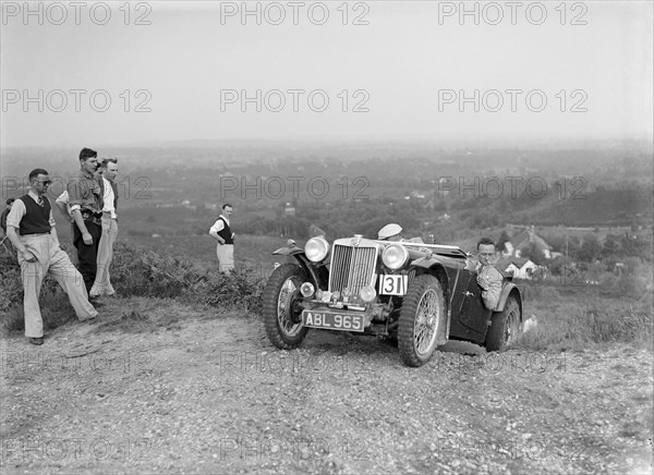 1936 MG TA of the Three Musketeers team taking part in the NWLMC Lawrence Cup Trial, 1937. Artist: Bill Brunell.