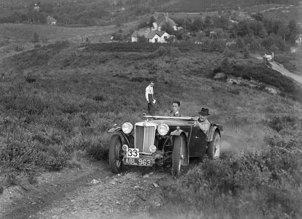 1936 MG TA of the Three Musketeers team taking part in the NWLMC Lawrence Cup Trial, 1937. Artist: Bill Brunell.