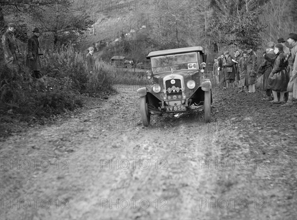 1928 Austin 12/4 4-seater tourer taking part in the Inter-Varsity Trial, 1930. Artist: Bill Brunell.