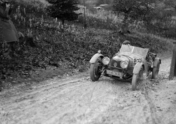 Riley Brooklands 2-seater sports of JE Lancaster taking part in the Inter-Varsity Trial, 1930. Artist: Bill Brunell.