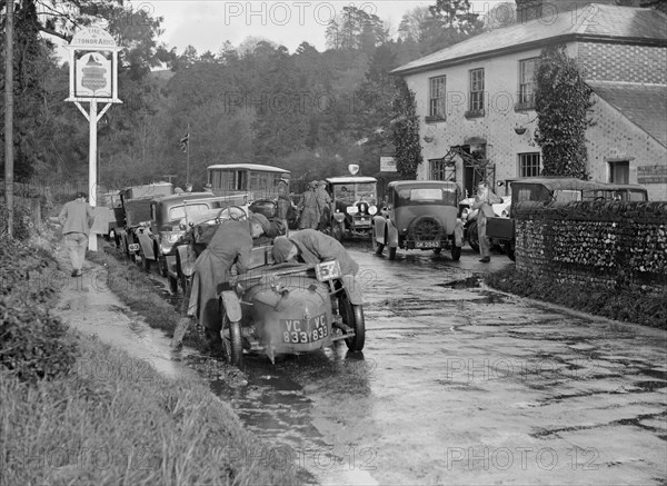 Riley Brooklands outside the Stonor Arms Hotel, Henley-on-Thames, Inter-Varsity Trial, 1930. Artist: Bill Brunell.