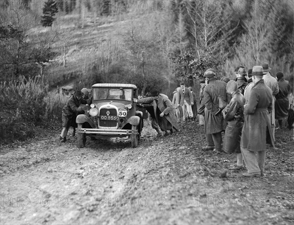 KHL Seaton's Ford Model A saloon receiving a push in the Inter-Varsity Trial, 1930. Artist: Bill Brunell.