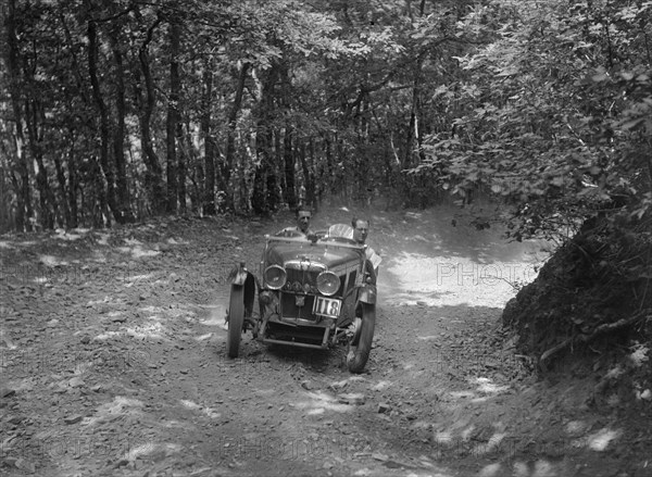 MG J2 competing in the B&HMC Brighton-Beer Trial, Fingle Bridge Hill, Devon, 1934. Artist: Bill Brunell.