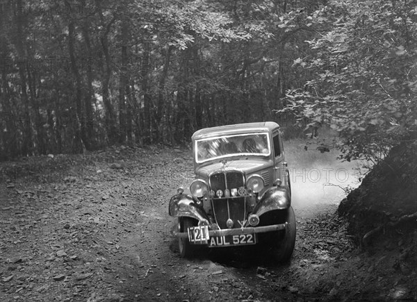 Standard Little Nine saloon, B&HMC Brighton-Beer Trial, Fingle Bridge Hill, Devon, 1934. Artist: Bill Brunell.