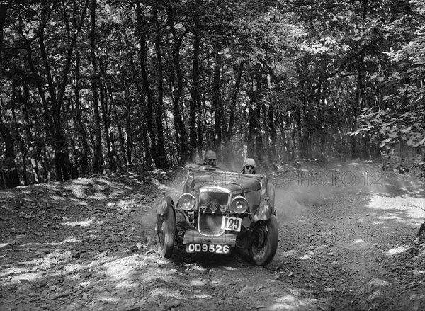 Hillman Aero Minx competing in the B&HMC Brighton-Beer Trial, Fingle Bridge Hill, Devon, 1934. Artist: Bill Brunell.