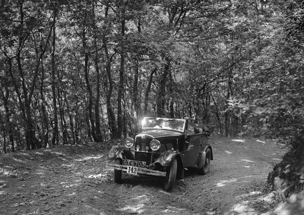 Crossley of CR Simnett competing in the B&HMC Brighton-Beer Trial, Fingle Bridge Hill, Devon, 1934. Artist: Bill Brunell.