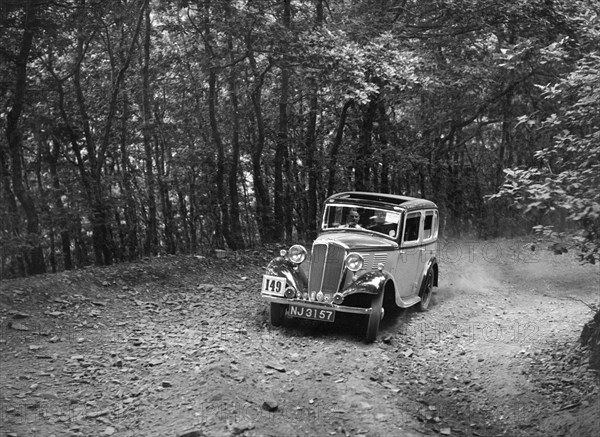 Standard competing in the B&HMC Brighton-Beer Trial, Fingle Bridge Hill, Devon, 1934. Artist: Bill Brunell.