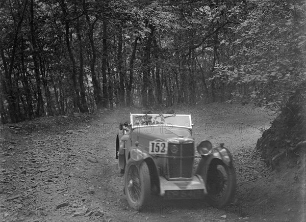 MG Magna competing in the B&HMC Brighton-Beer Trial, Fingle Bridge Hill, Devon, 1934. Artist: Bill Brunell.