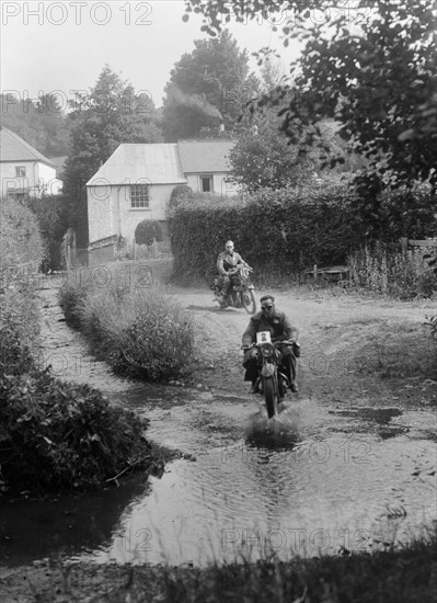 Motorcycles competing in the B&HMC Brighton-Beer Trial, Windout Lane, near Dunsford, Devon, 1934. Artist: Bill Brunell.