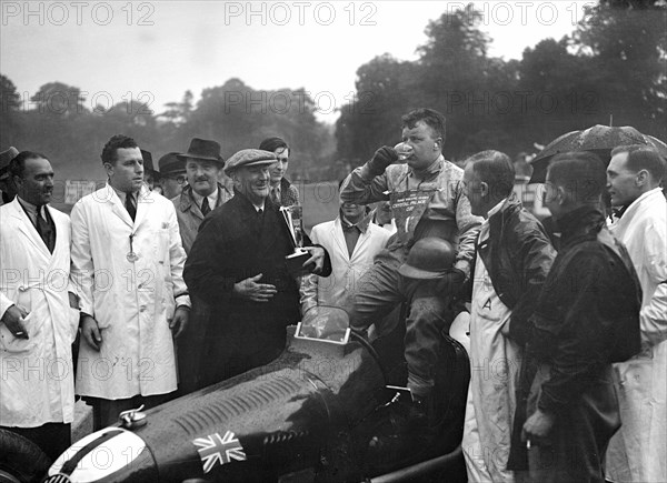 Bert Hadley and his winning Austin car, Imperial Trophy, Crystal Palace, 1939. Artist: Bill Brunell.
