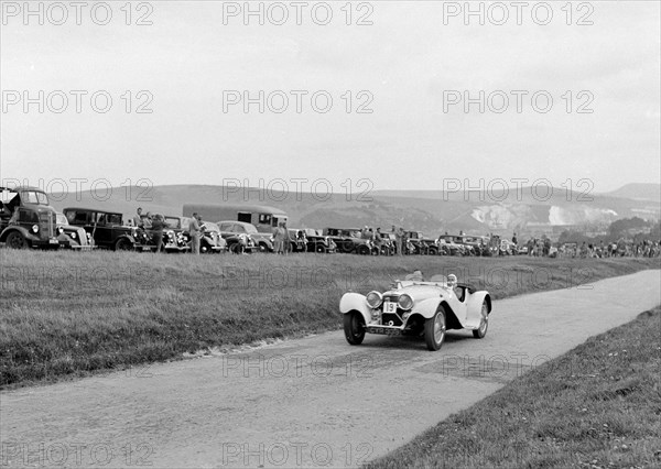 Jaguar SS100 of LJ Simmons competing at the Lewes Speed Trials, Sussex, 1938. Artist: Bill Brunell.