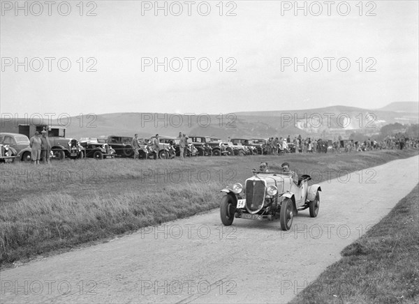 Ford V8 open tourer of GJC Matthews competing at the Lewes Speed Trials, Sussex, 1938. Artist: Bill Brunell.