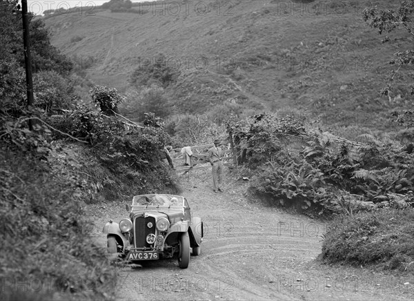 1935 Triumph Gloria Southern Cross taking part in a motoring trial in Devon, late 1930s. Artist: Bill Brunell.