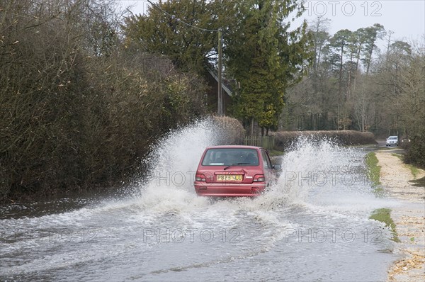 Rover Metro driving through floods at Beaulieu 2008. Artist: Unknown.