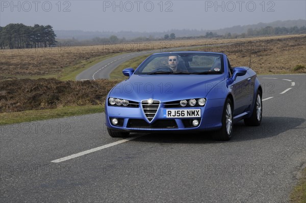 2006 Alfa Romeo Spyder driving in New Forest. Artist: Unknown.