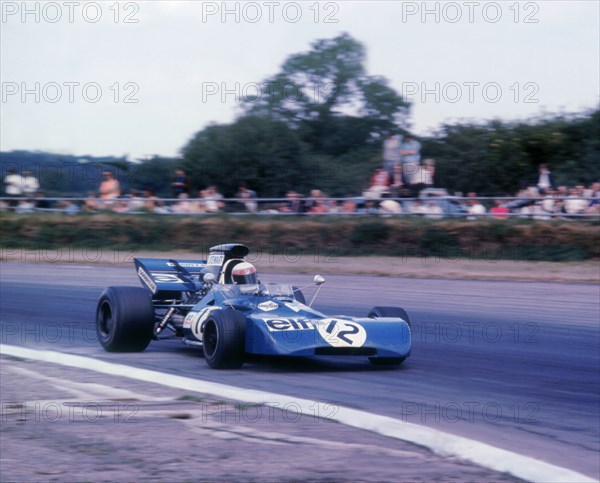 Tyrrell 003 driven by Jackie Stewart in 1971 British GP. Artist: Unknown.