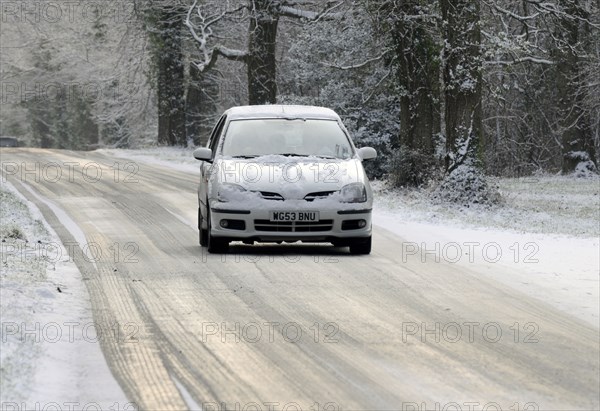 2003 Nissan Almera driving on icy road in winter Artist: Unknown.