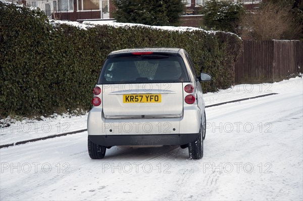 2007 Smart car sliding on snowy road Artist: Unknown.