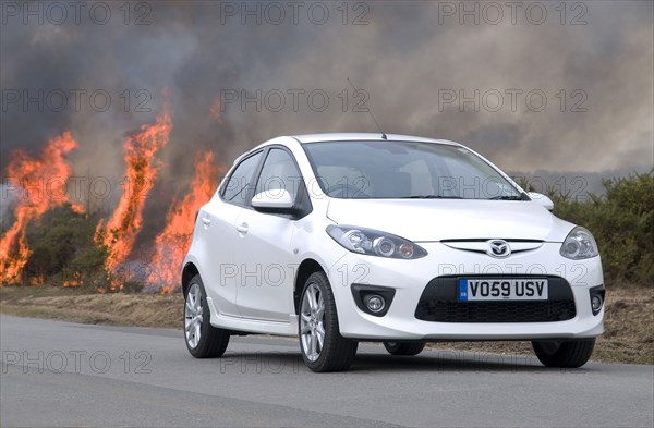 2010 Mazda 2 Sport, controlled burning in New Forest Artist: Unknown.