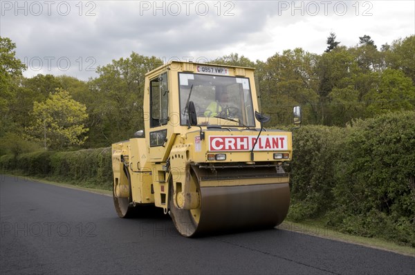 Road resurfacing work repairing potholes Artist: Unknown.