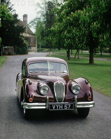 1957 Jaguar XK 140 Artist: Unknown.