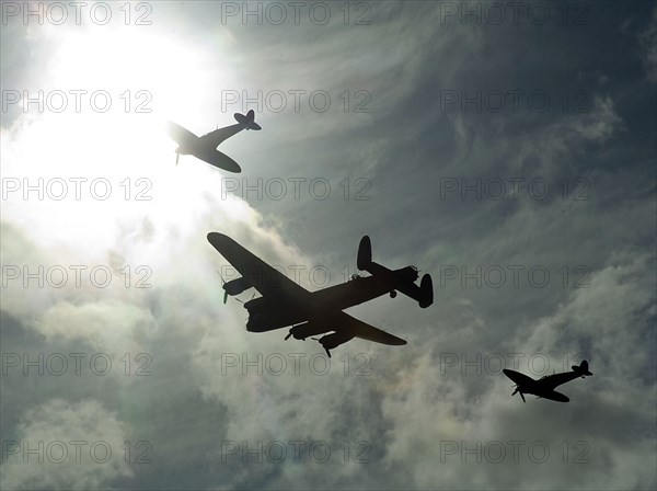 2011 Goodwood Revival Meeting, Lancaster bomber and 2 Spitfires in aerial display. Artist: Unknown.