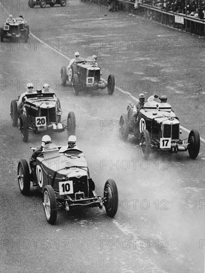 1933 Ulster TT, MG Magnette K3 Nuvolari, car number 17, trails Riley Artist: Unknown.