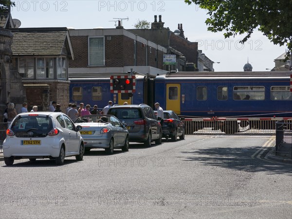 Train passing through level crossing in Lincoln 2014 Artist: Unknown.