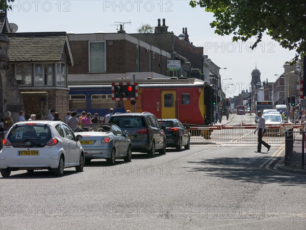 Train passing through level crossing in Lincoln 2014 Artist: Unknown.