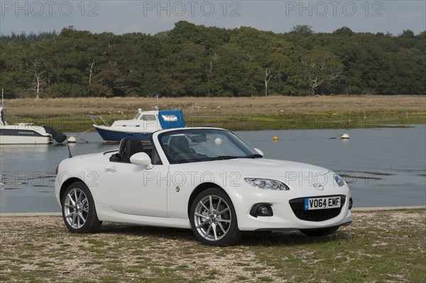 2014 Mazda MX5 Roadster Coupe Artist: Unknown.