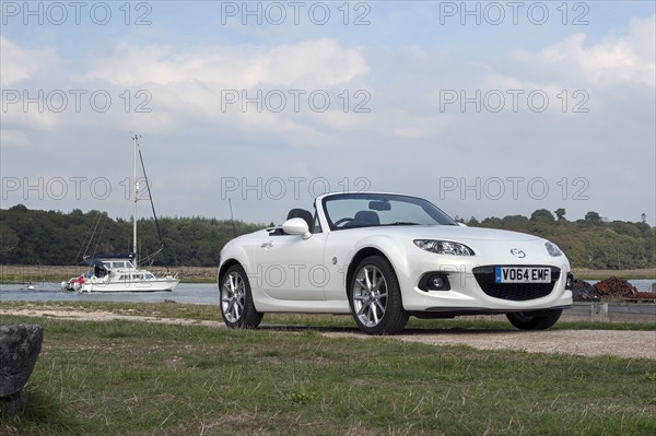2014 Mazda MX5 Roadster Coupe Artist: Unknown.