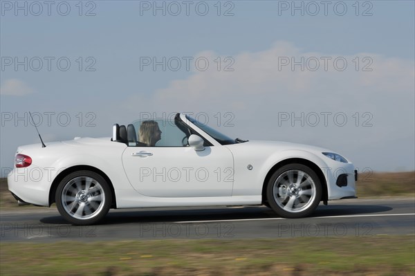 2014 Mazda MX5 Roadster Coupe Artist: Unknown.