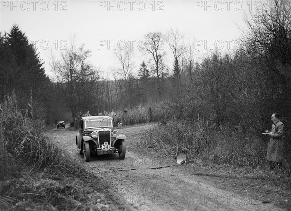 1935 Singer 9 fixed-head coupe competing in the Great West Motor Club Thatcher Trophy, 1938. Artist: Bill Brunell.