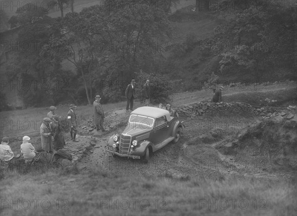 Ford V8 2-seater and dickey of JB Thompson competing in the MCC Sporting Trial, 1935. Artist: Bill Brunell.