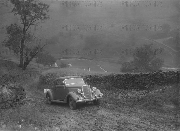 Ford V8 2-seater and dickey of IDK Stewart competing in the MCC Sporting Trial, 1935. Artist: Bill Brunell.