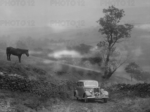 Ford V8 saloon of RE Alexander competing in the MCC Sporting Trial, 1935. Artist: Bill Brunell.