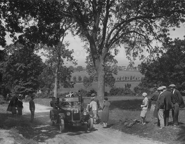 Austin 12/4 open 4-seater tourer competing in the JCC Inter-Centre Rally, 1932. Artist: Bill Brunell.