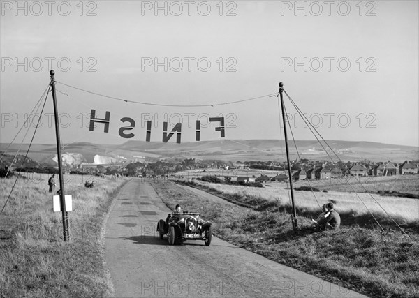 Fiat Balilla of F Andrews competing at the Bugatti Owners Club Lewes Speed Trials, Sussex, 1937. Artist: Bill Brunell.