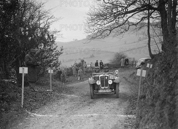 Austin 7 Grasshopper of WH Scriven competing in the MG Car Club Midland Centre Trial, 1938. Artist: Bill Brunell.